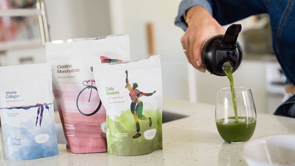 Marine collagen, creatine, daily greens on kitchen bench