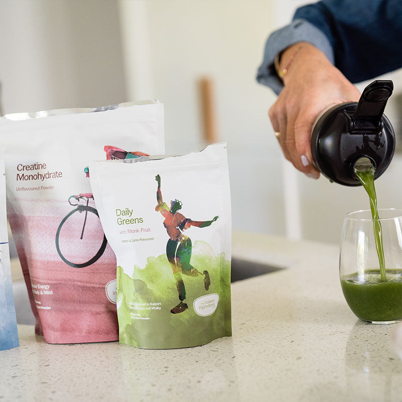 Marine collagen, creatine, daily greens on kitchen bench