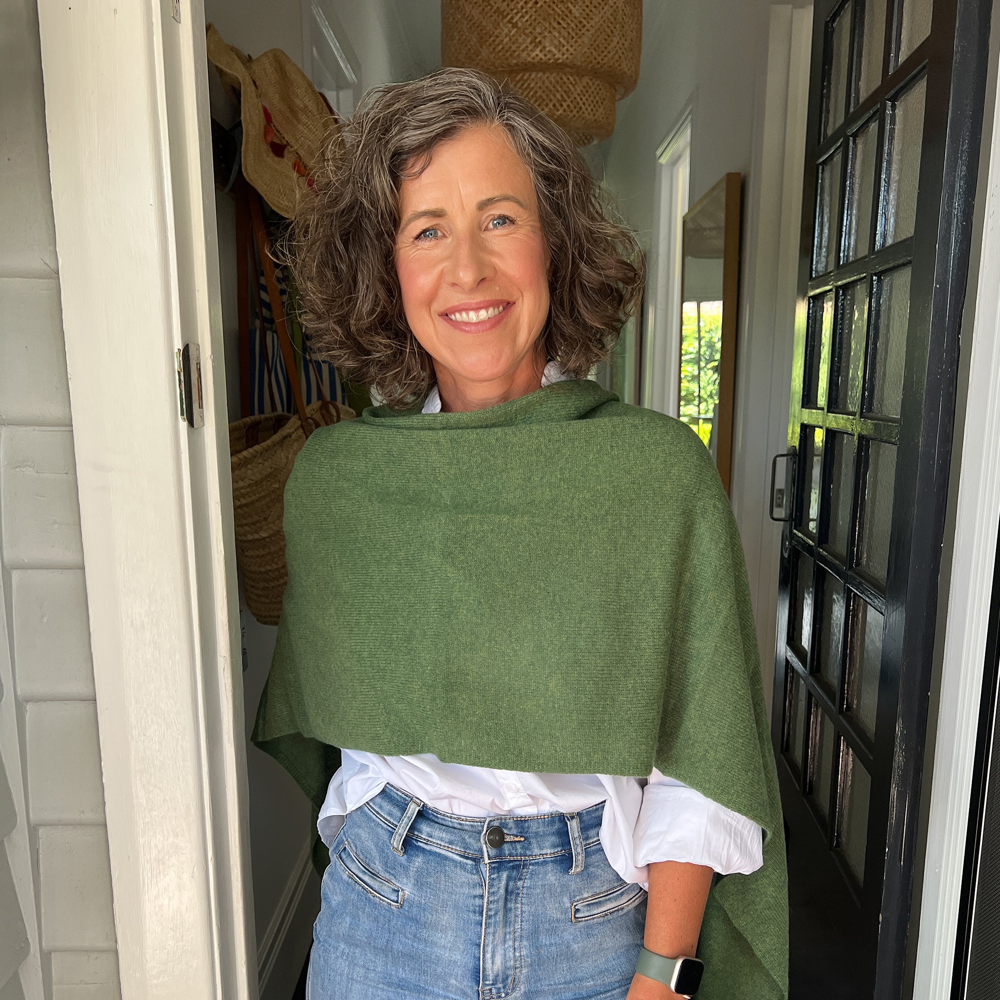 Amy wearing a Cashmere Topper in Basil