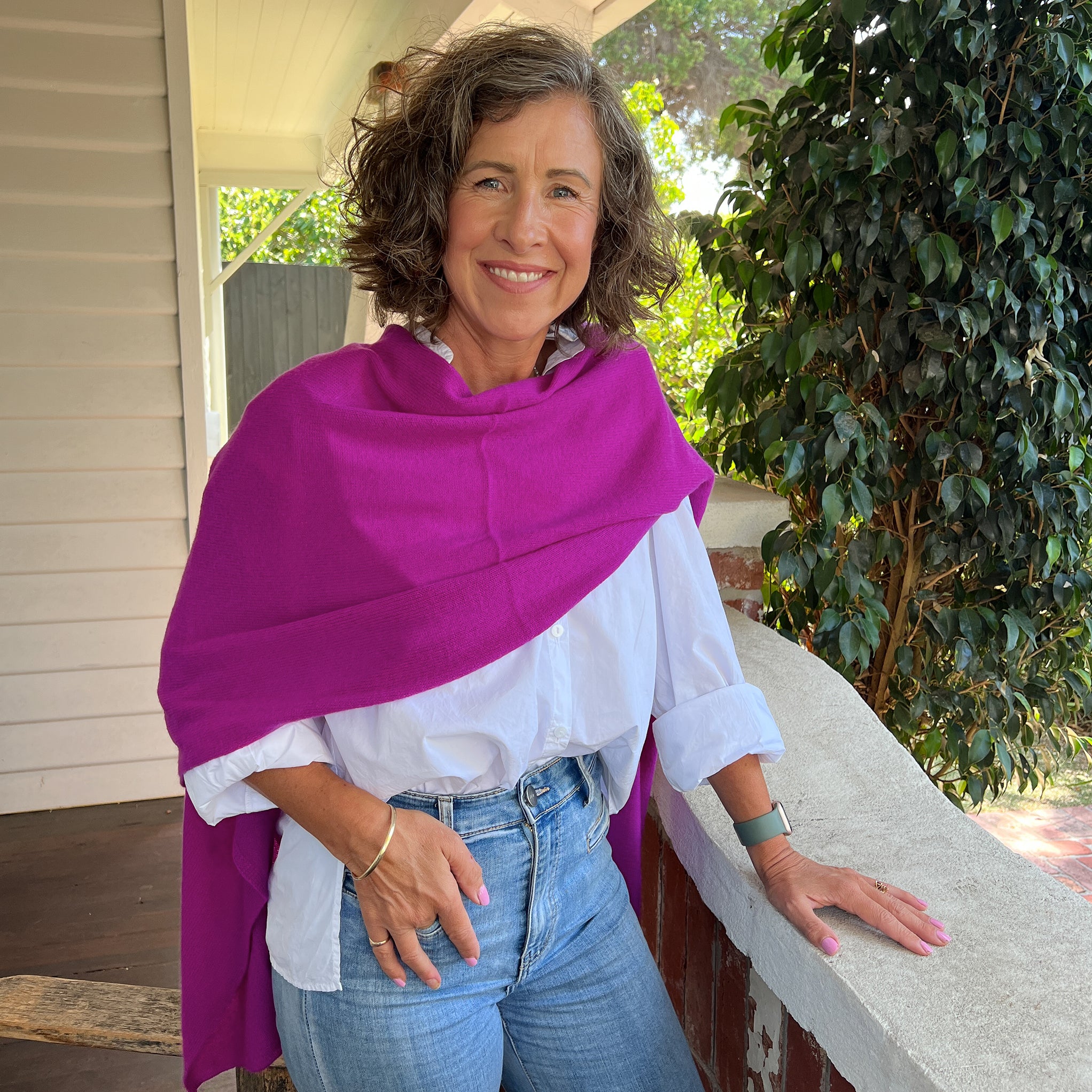 Amy wearing a Cashmere Topper in Boysenberry