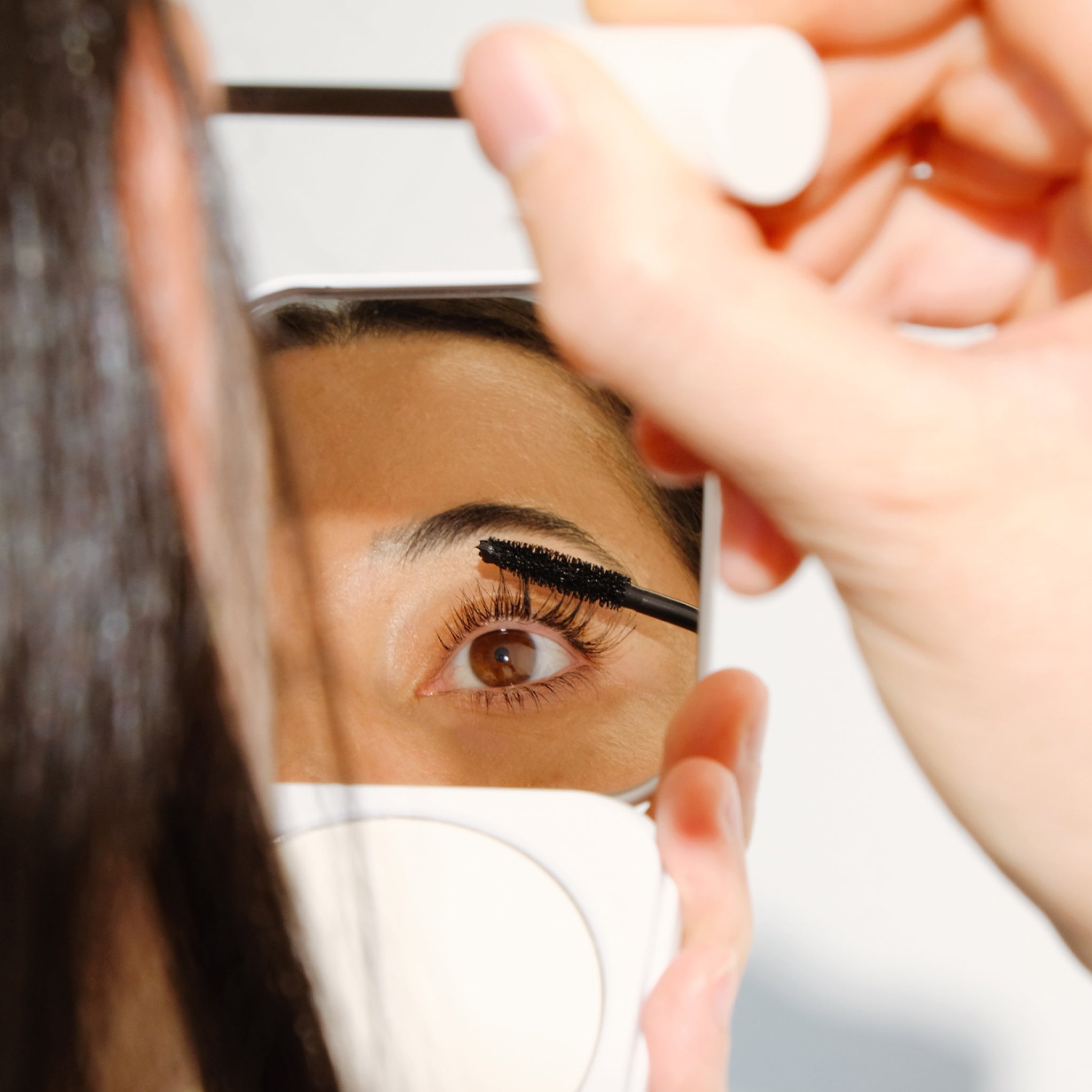 Model applying Aleph Lift/Lengthen Mascara