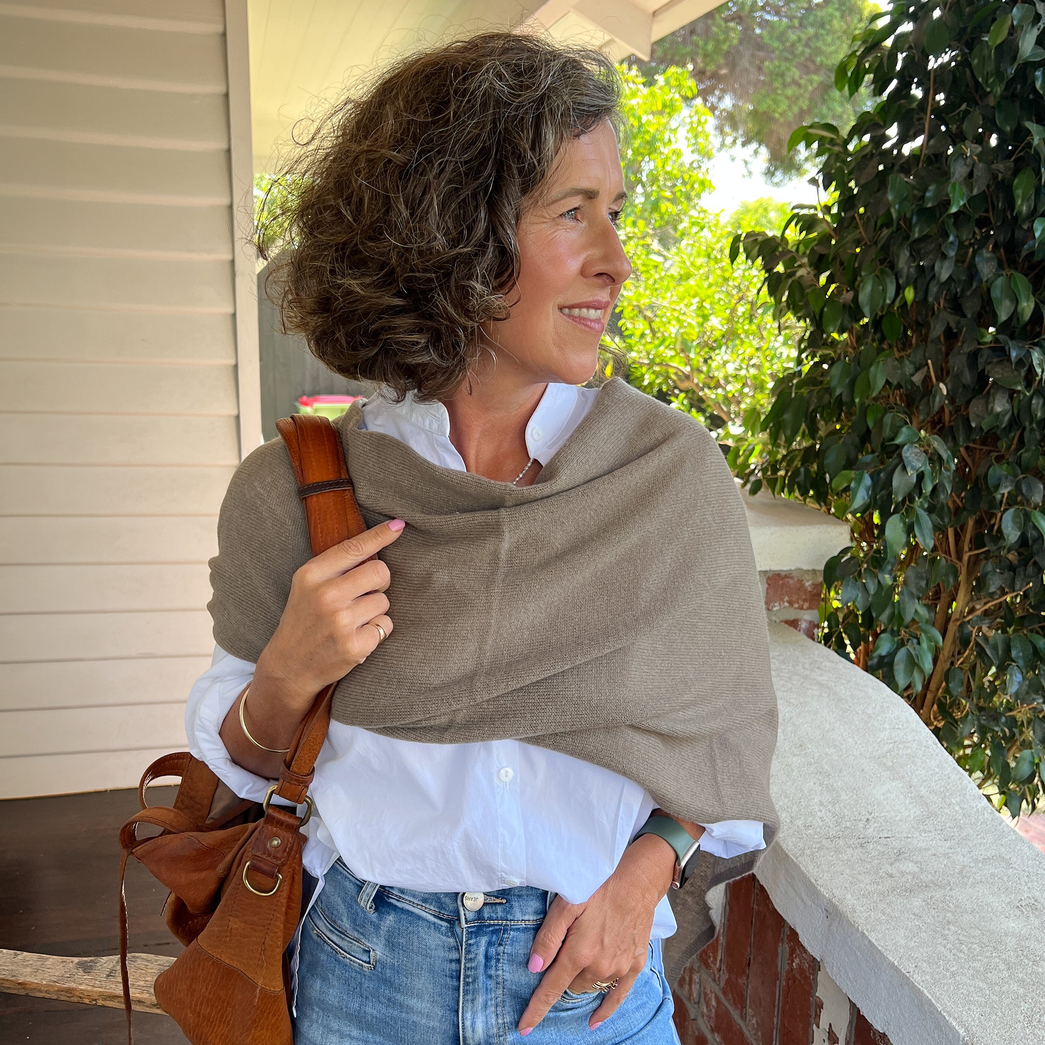 Amy wearing a Cashmere Topper in Truffle