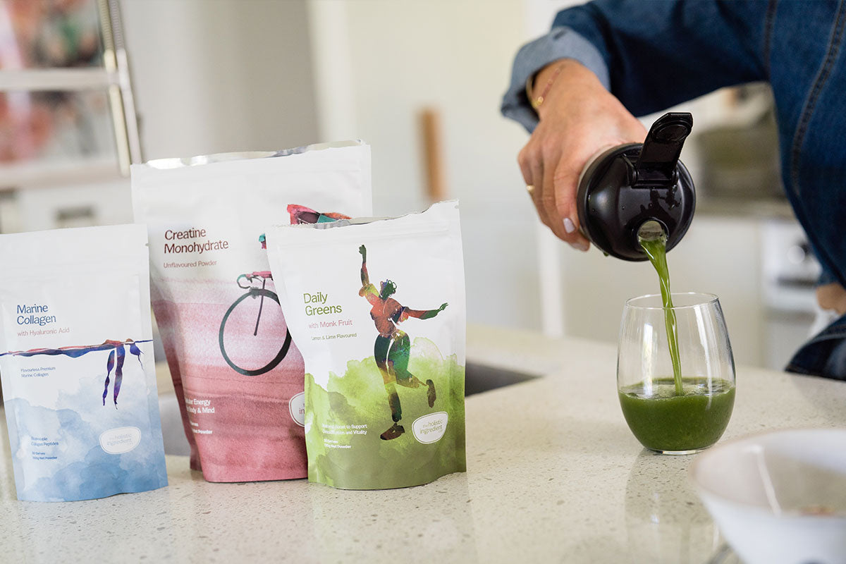 Marine collagen, creatine, daily greens on kitchen bench