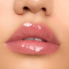 Close-up of model wearing Aleph Aura Gloss: Bare