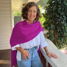 Amy wearing a Cashmere Topper in Boysenberry