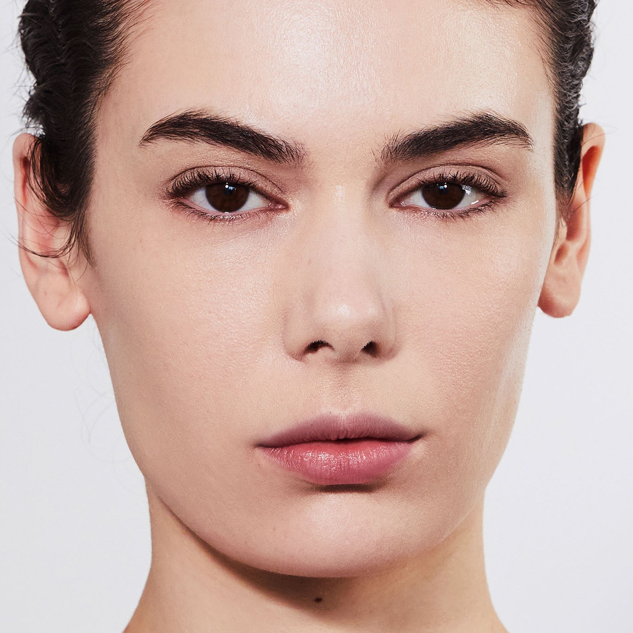 Model wearing Aleph Concealer /  Foundation - 0.5 Neutral/Yellow Fair
