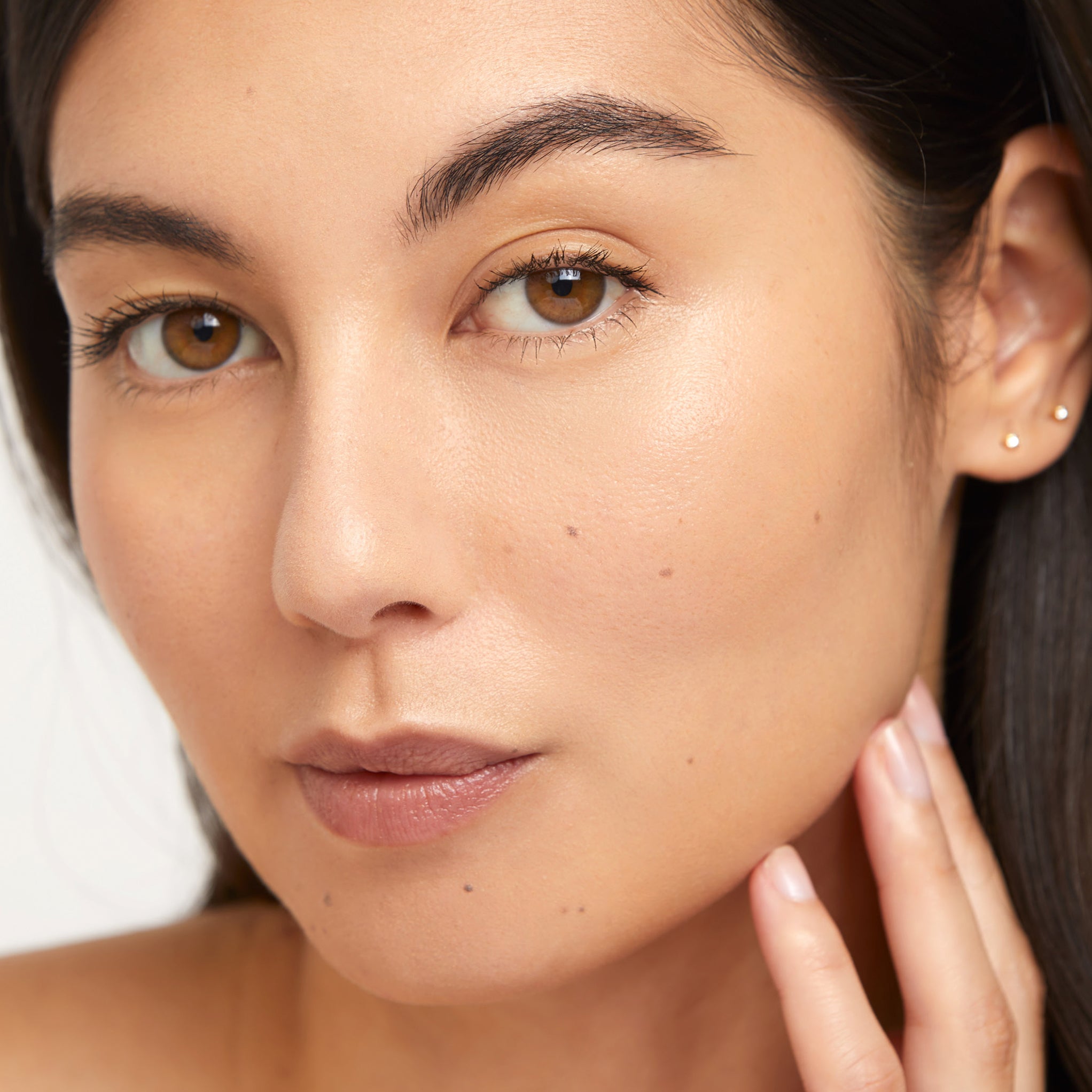 Model wearing Aleph Concealer /  Foundation - 3 Olive Medium