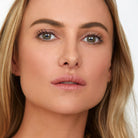 Model wearing Aleph Concealer /  Foundation - 3.5 Tan Medium