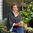 Amy wearing a Cashmere Topper in Charcoal