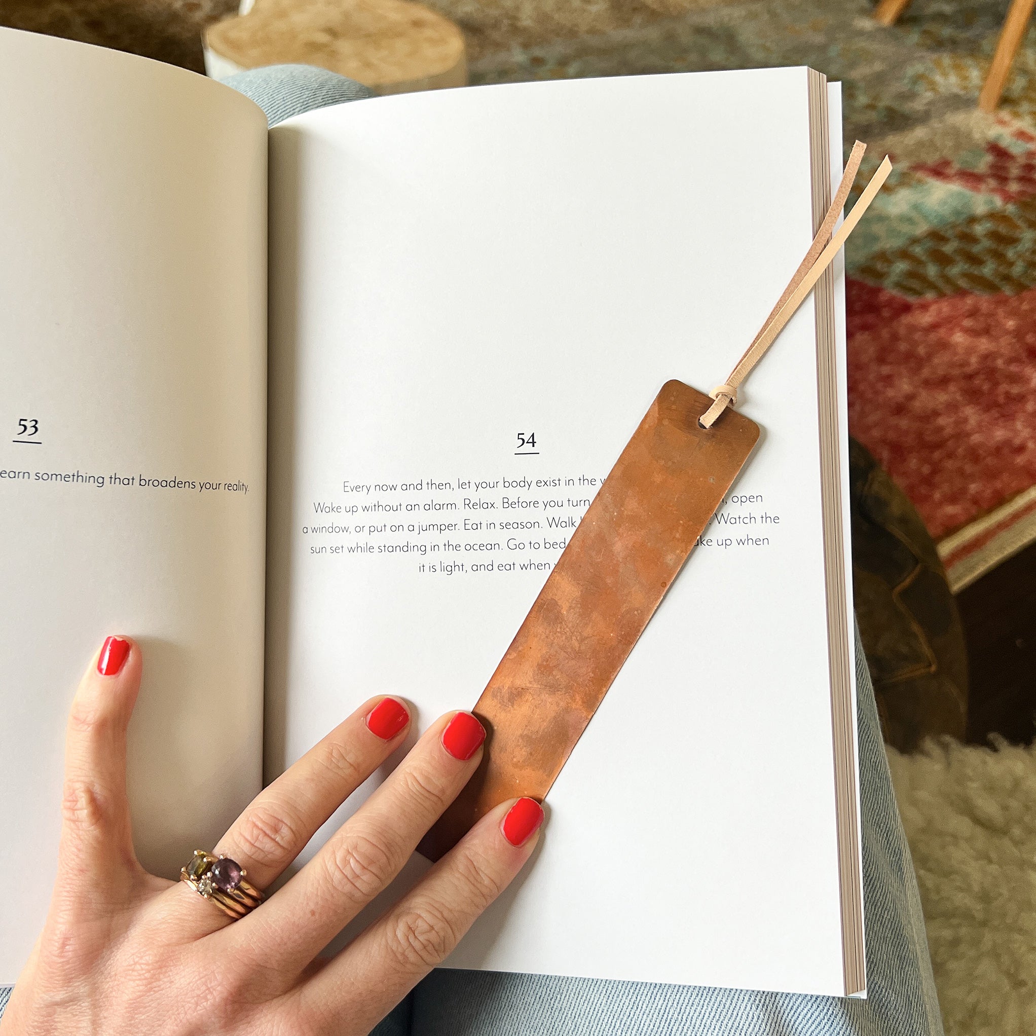 Copper bookmark and an open book 