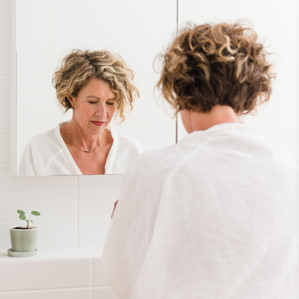 Amy in using The Holistic Ingredient Cotton Make Up  Remover in her bathroom