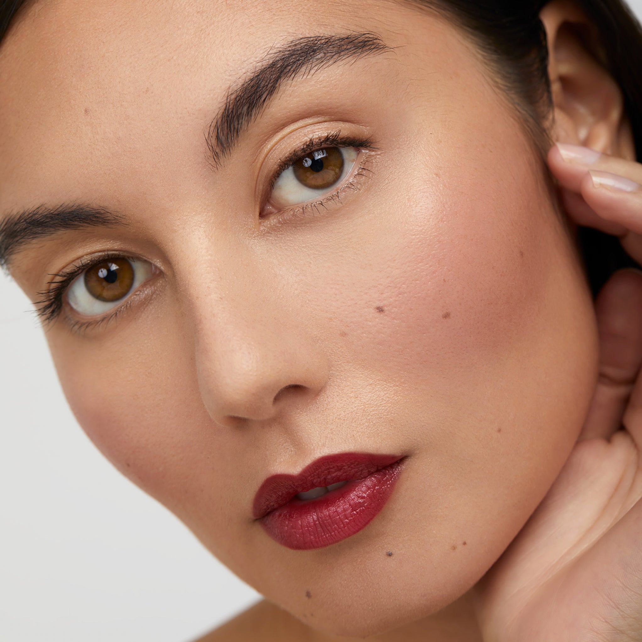 Model wearing Aleph Cheek/Lip Tint: Crush
