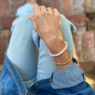 Amy wears a 6mm Rose Quartz bracelet