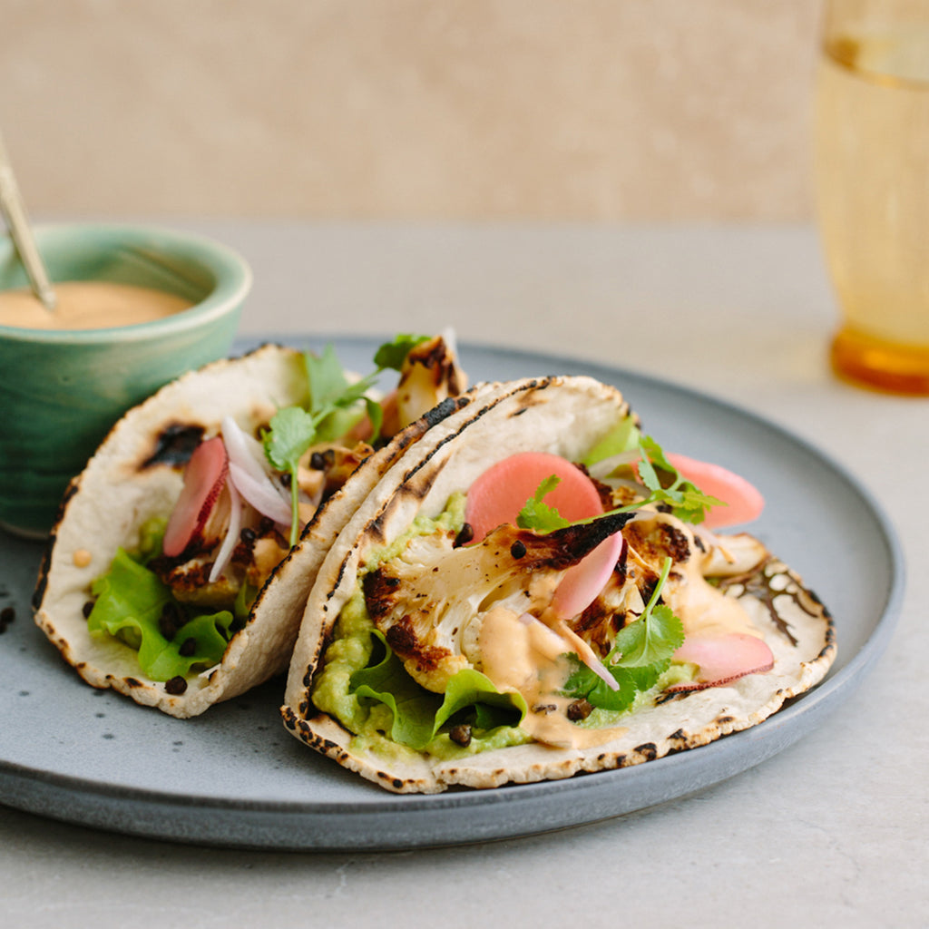 Roasted cauli + sizzled lentl tacos with pickled radish + chipotle cashew sauce