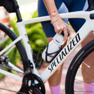 Amy preparing for a ride on her bike with a bottle of Daily Hydration Blend