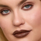 Close-up of model wearing Aleph Eye/Lip Multi-Liner: Umber