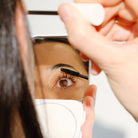 Model applying Aleph Lift/Lengthen Mascara