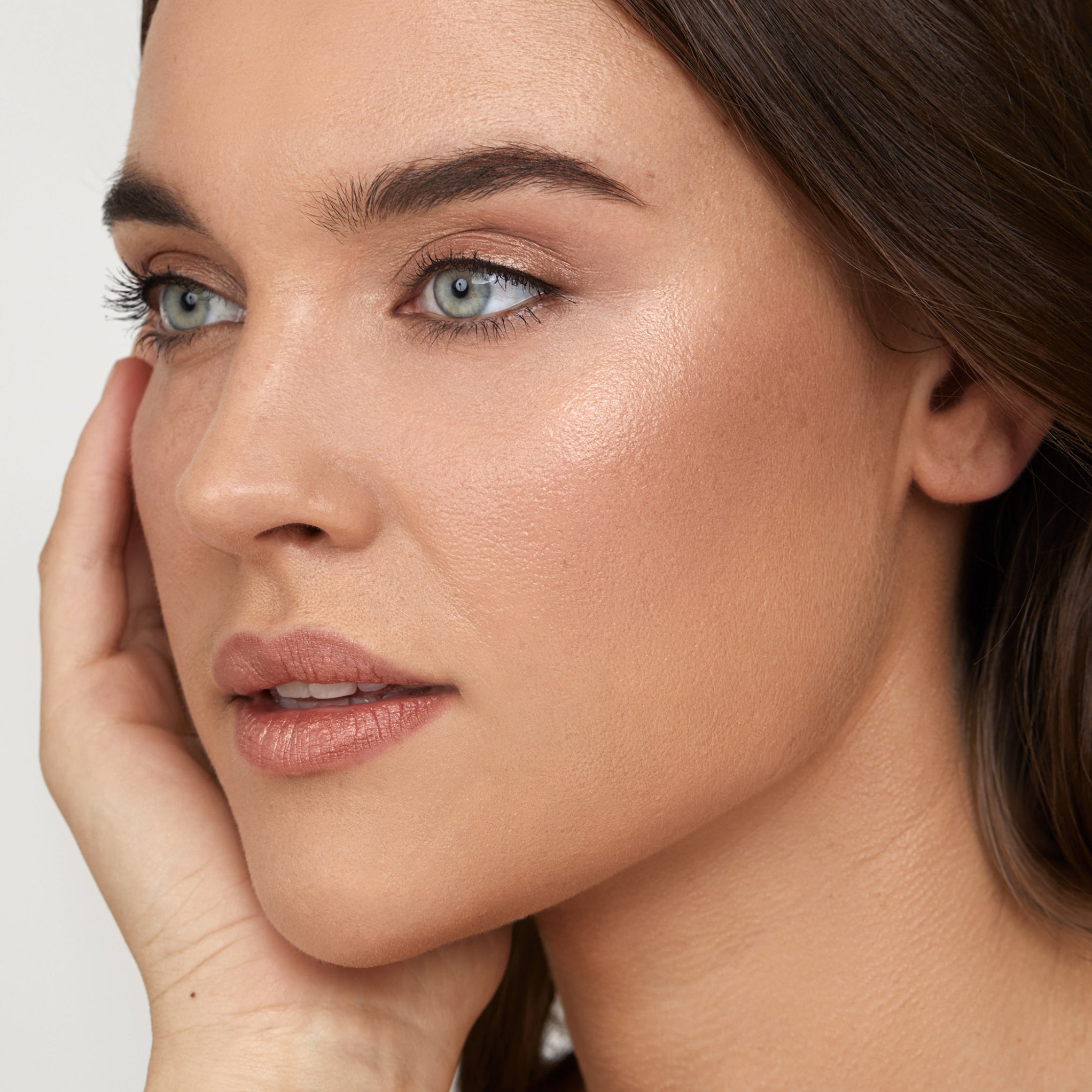 Model wearing Aleph Radiance Balm Sun