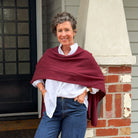 Amy wearing a Cashmere Topper in Sangria