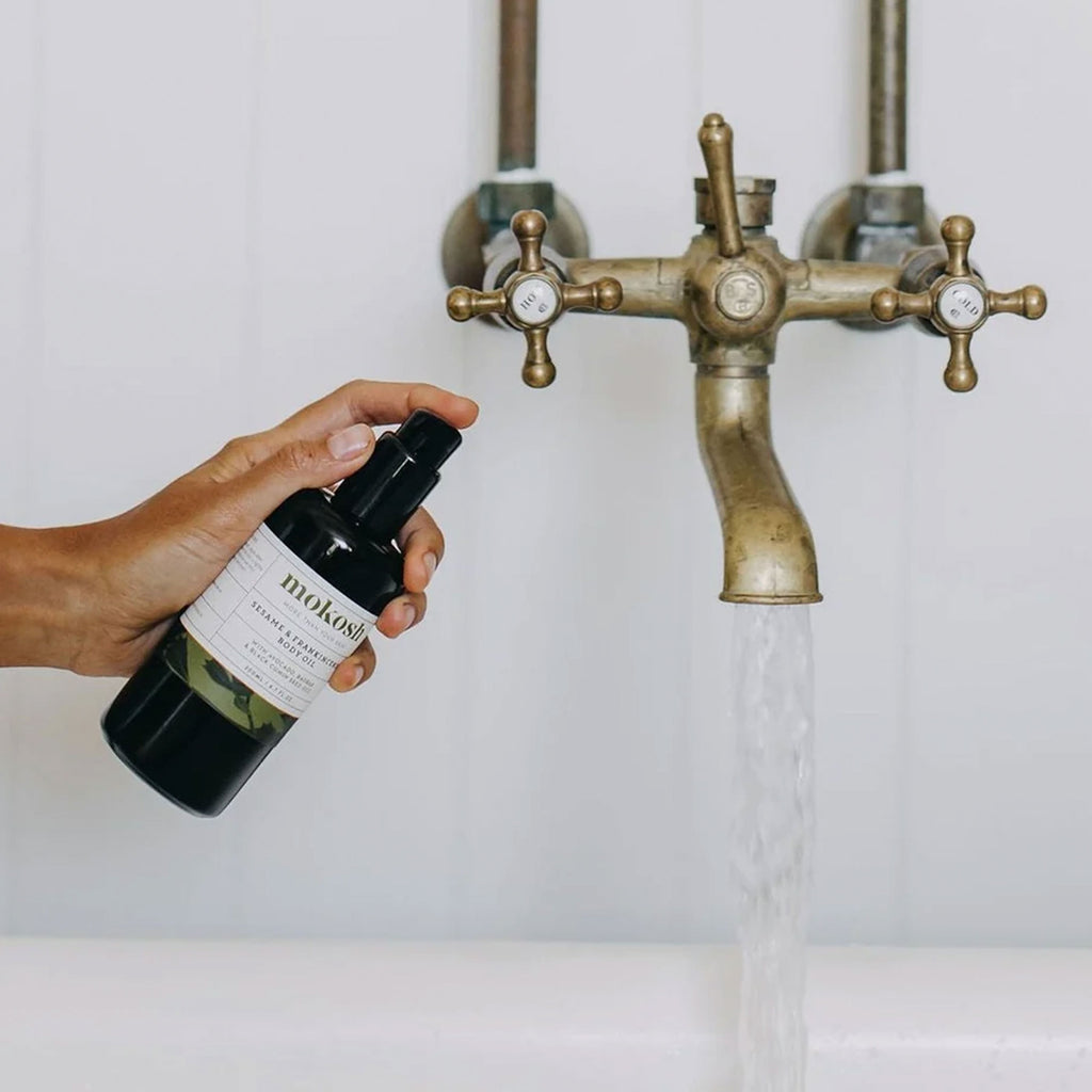 Adding Mokosh's Sesame and Frankincense Body Oil to the bath