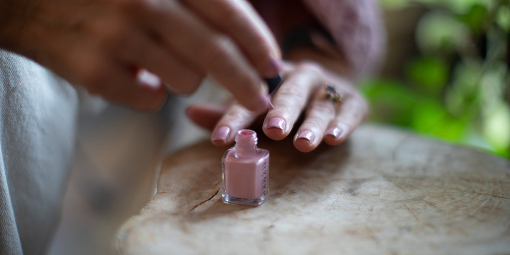 Amy painting her nails with Hanami nail polish 