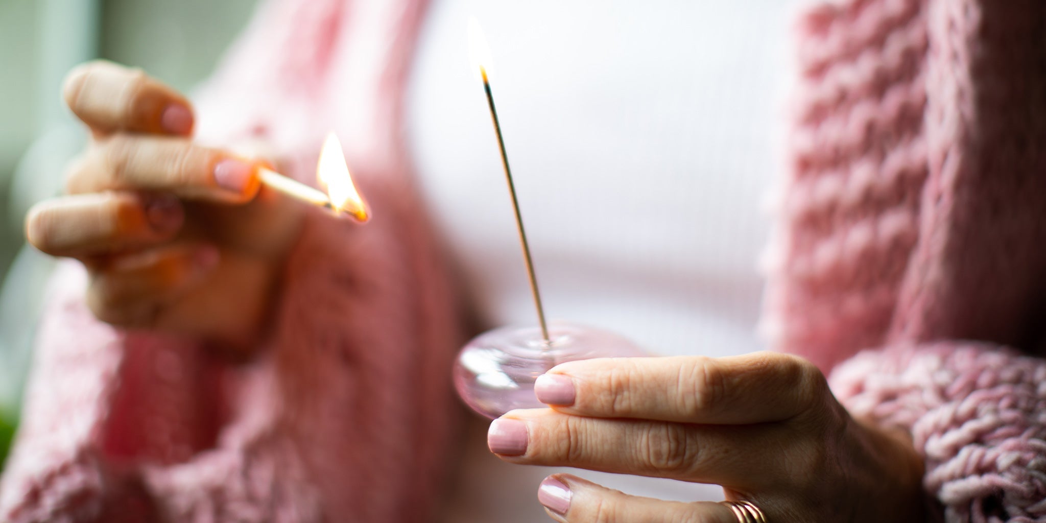 Amy lighting Australian Sandalwood Incense by the Holistic Ingredient. 