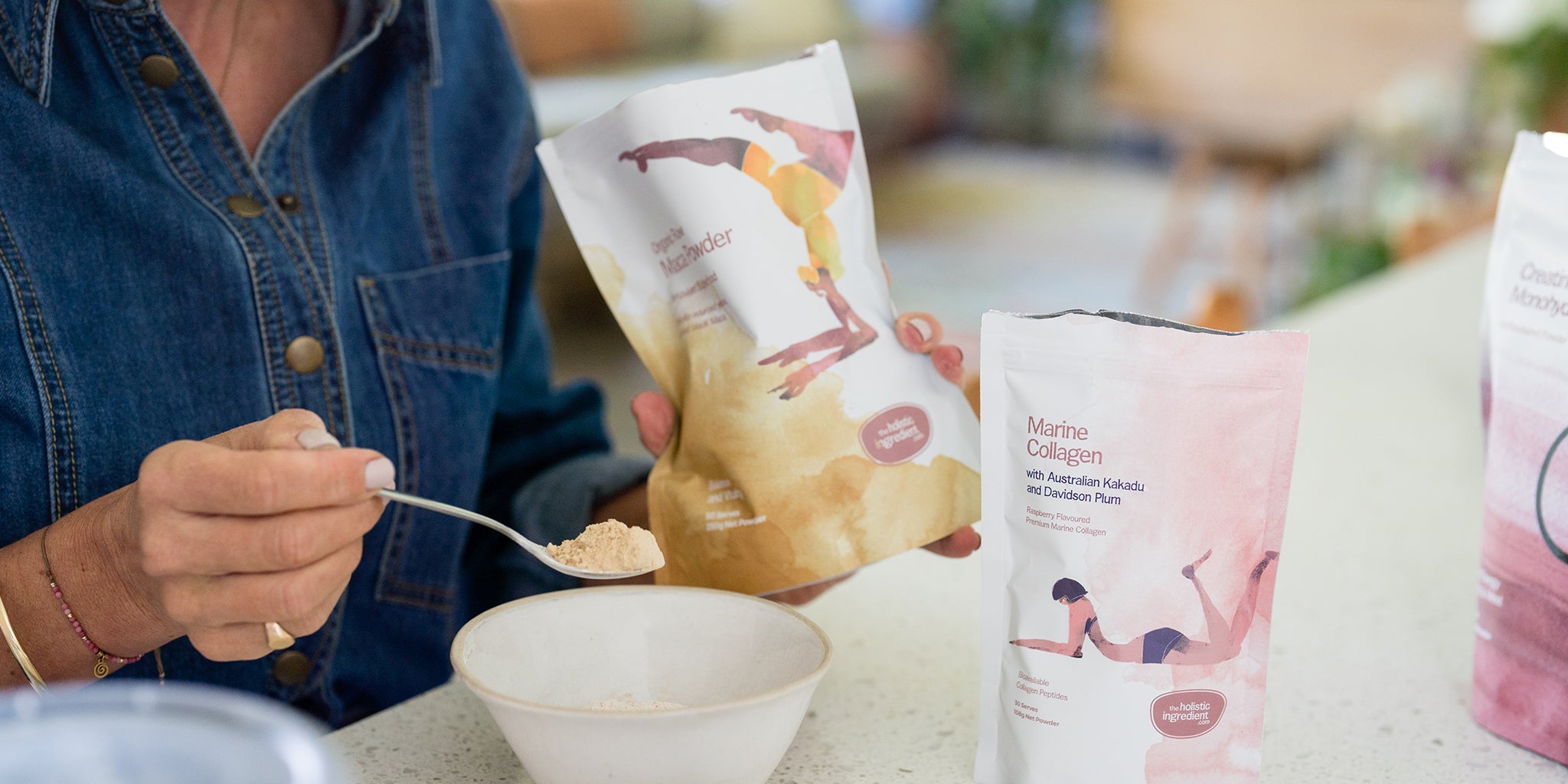 Amy adding Organic Raw Maca Powder to a bowl 