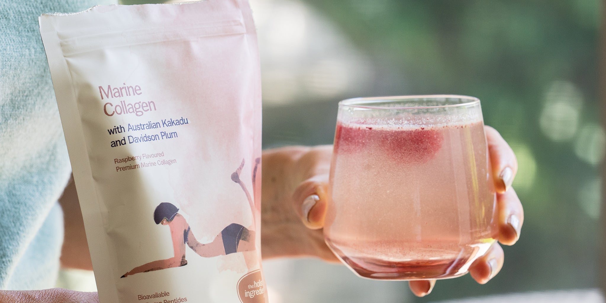 Amy holding a glass and a package labeled 'Marine Collagen' with blurred background