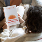 Amy reading The Anxiety Reset Method by Georgie Collinson
